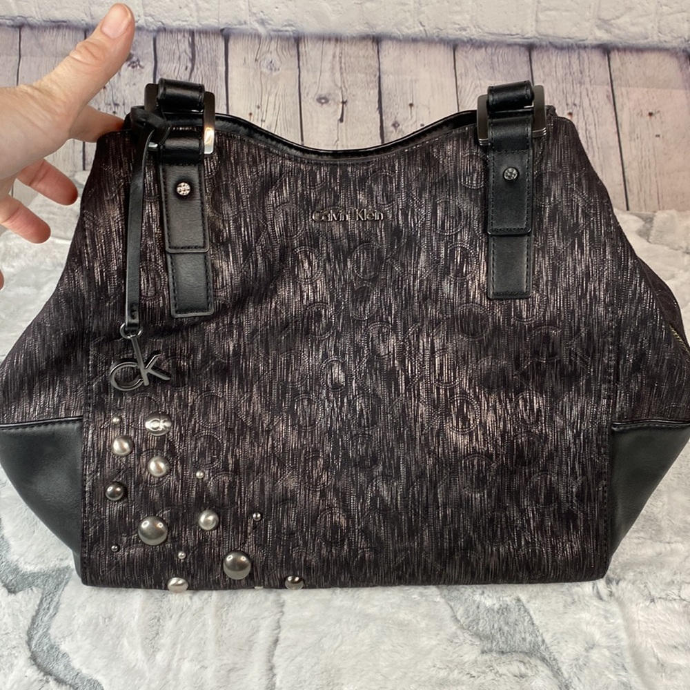 Calvin Klein hobo bag black fabric with silver thin lines with leather accents.